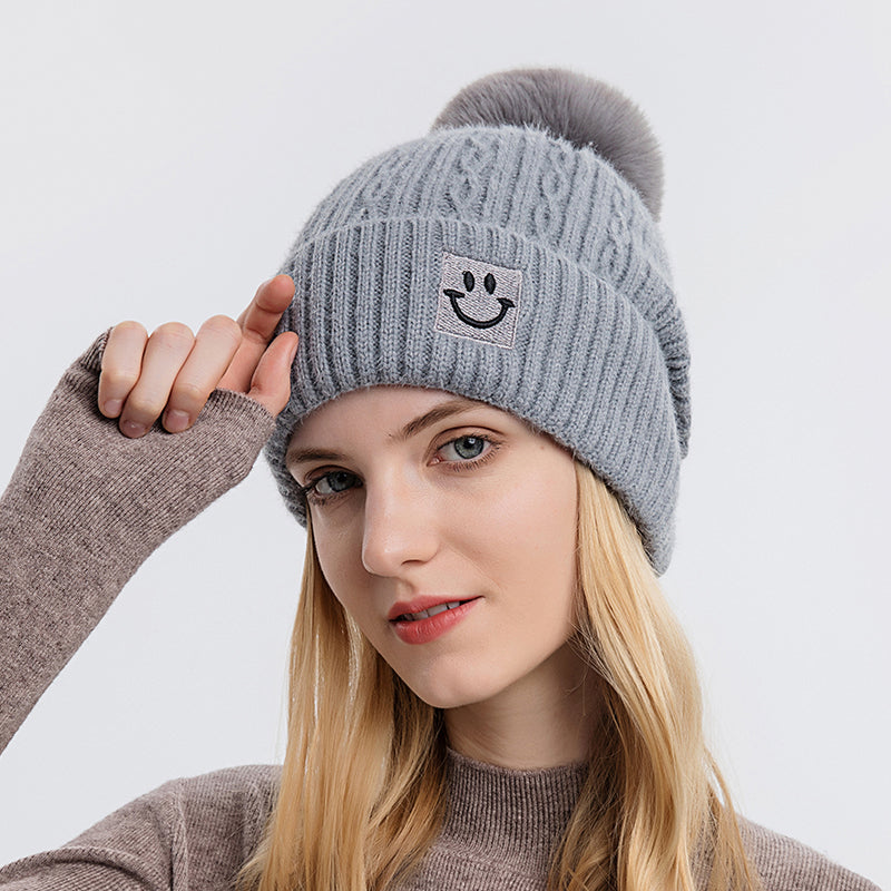 Embroidered smiling face wool hat