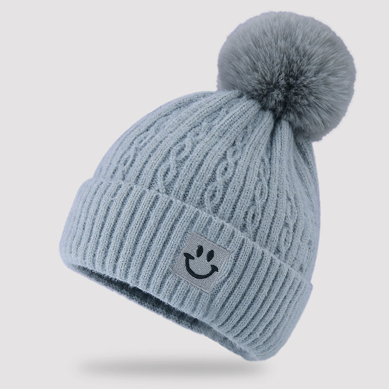 Embroidered smiling face wool hat