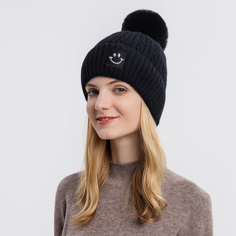 Embroidered smiling face wool hat