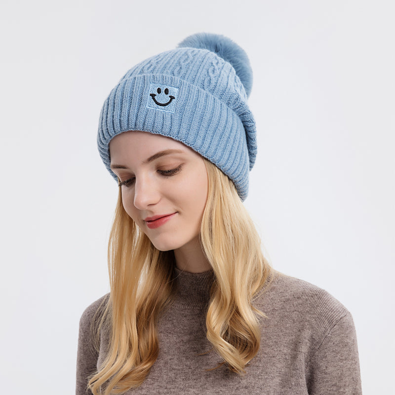 Embroidered smiling face wool hat